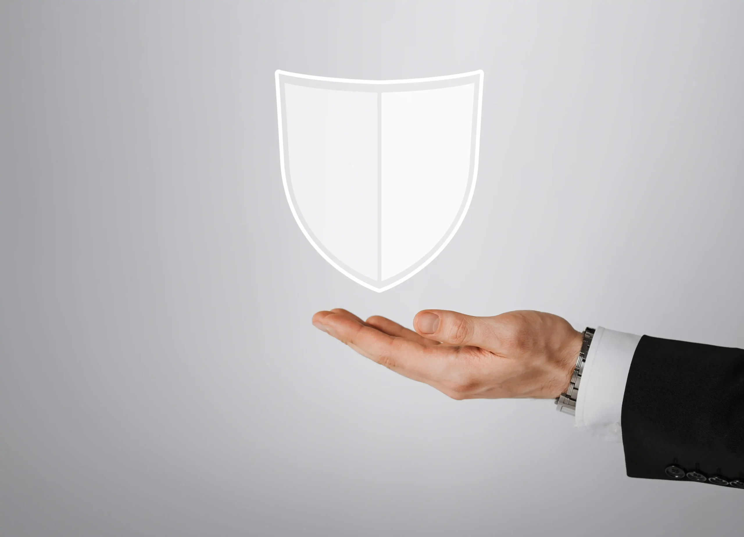 business people cyber protection concept close up male hand with virtual antivirus program shield icon gray background scaled